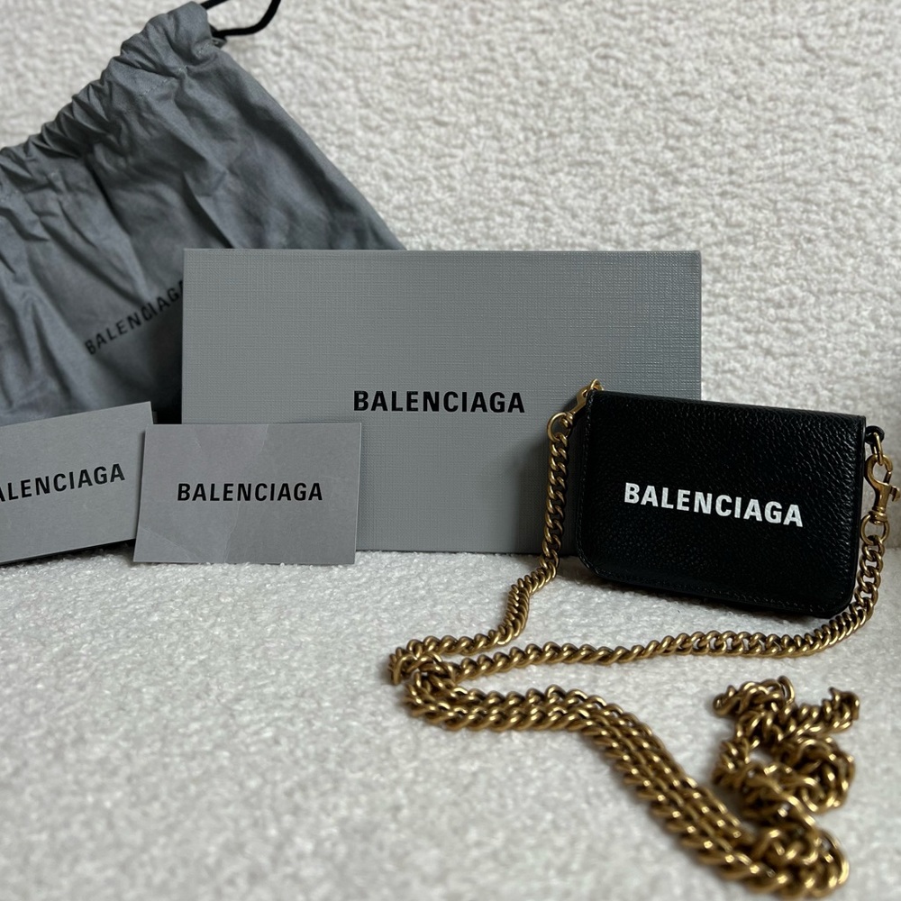 Balenciaga mini chain wallet.